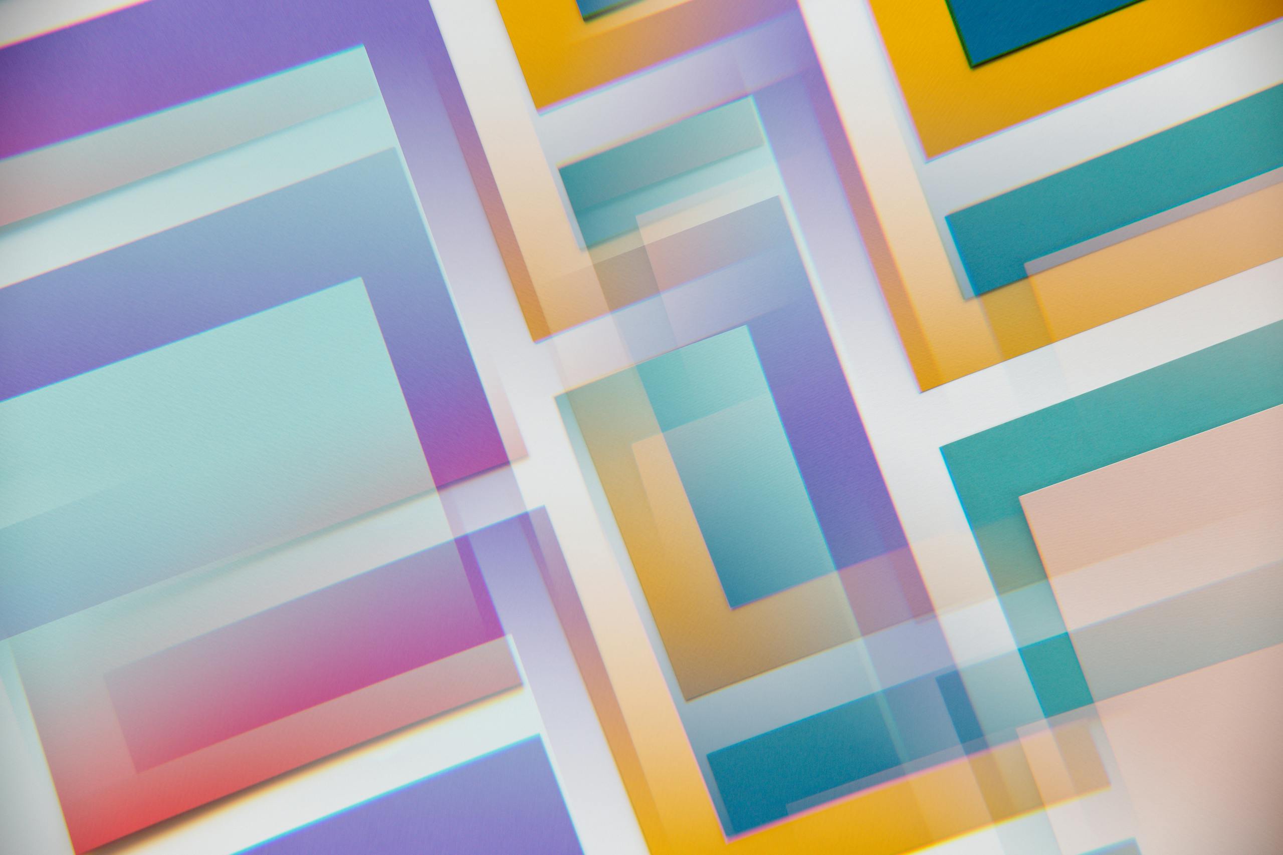 Photo by Edward Jenner A dynamic blend of overlapping pastel geometric shapes creating a vibrant abstract design.